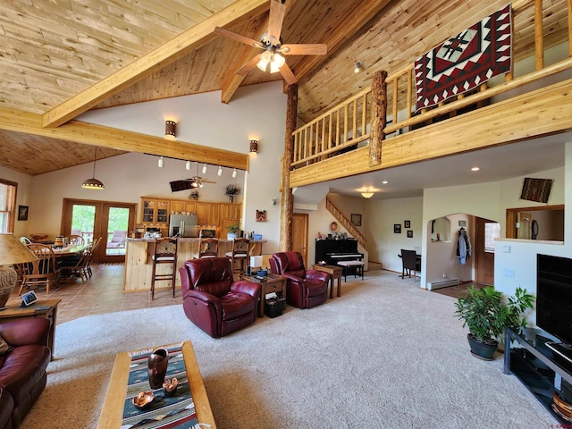 421 Elk Meadow Run, Antonito, CO 81120 - living area featuring wood ceiling with exposed beams, light carpet, stairway, high vaulted ceiling, and ceiling fan
