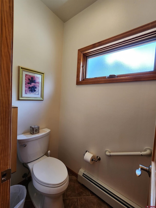 421 Elk Meadow Run, Antonito, CO 81120 - bathroom featuring baseboard heating, toilet, tile patterned floors, and baseboards