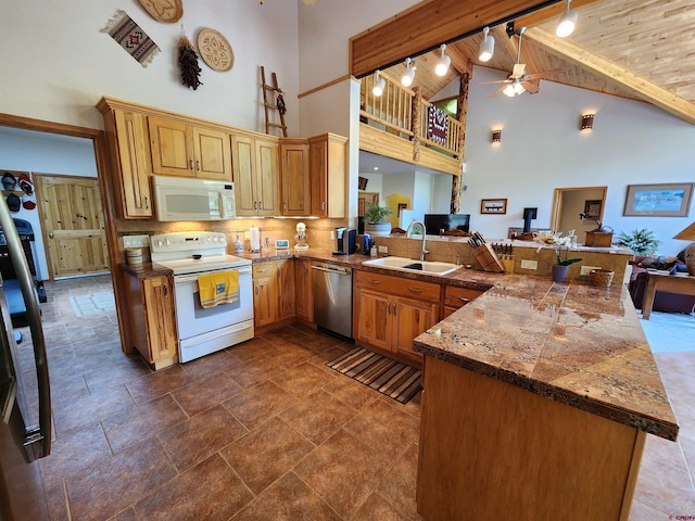 421 Elk Meadow Run, Antonito, CO 81120 - kitchen featuring white appliances, a sink, high vaulted ceiling, a peninsula, and a ceiling fan