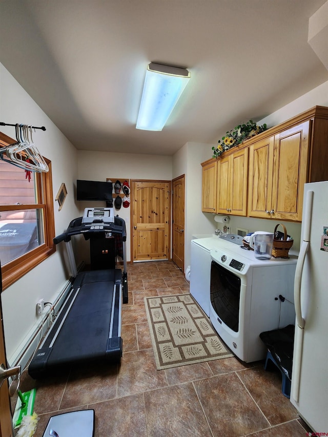 421 Elk Meadow Run, Antonito, CO 81120 - washroom featuring stone finish floors, separate washer and dryer, and cabinet space