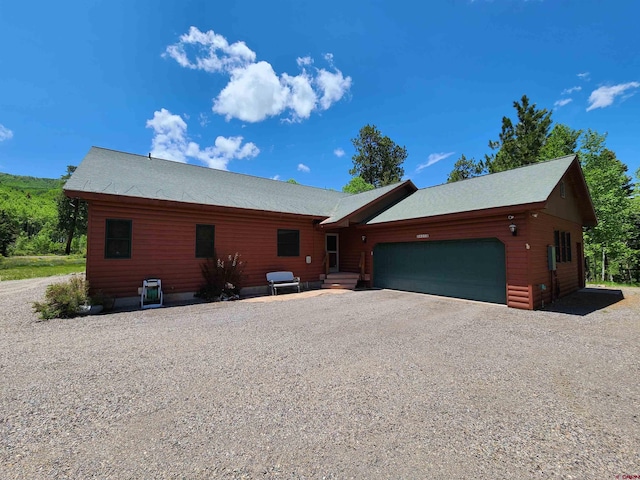 421 Elk Meadow Run, Antonito, CO 81120 - rustic home featuring a garage and driveway