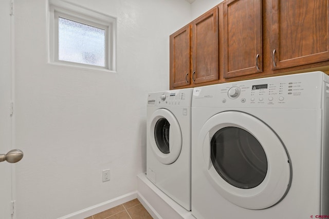 1602 S Taylor Cir, Bayfield, CO 81122 - washroom featuring cabinet space, washer and dryer, light tile patterned floors, and baseboards