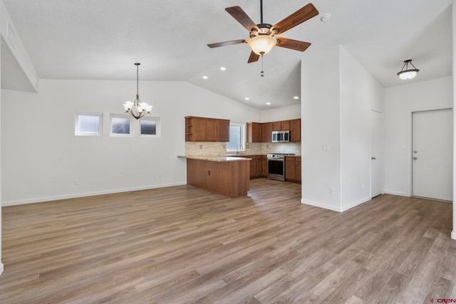 1602 S Taylor Cir, Bayfield, CO 81122 - kitchen featuring stainless steel appliances, open floor plan, a peninsula, brown cabinets, and ceiling fan