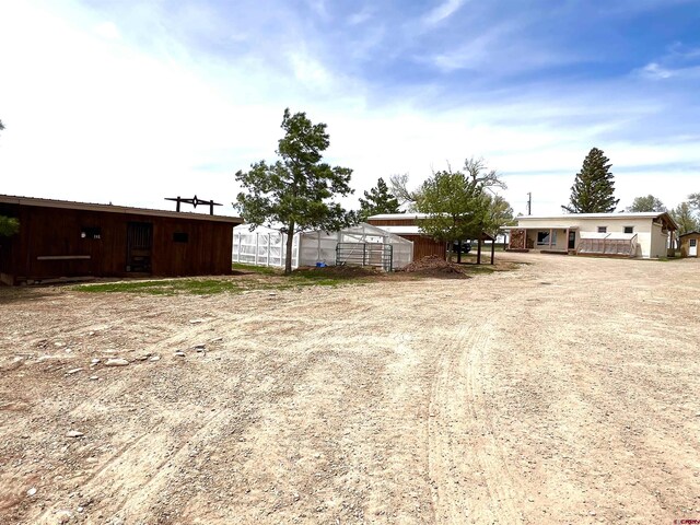 14702 Rd 14, Cahone, CO 81320 - view of yard with an outbuilding and driveway