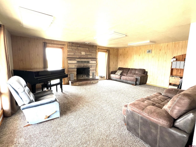 14702 Rd 14, Cahone, CO 81320 - living area with carpet floors, wood walls, and a fireplace