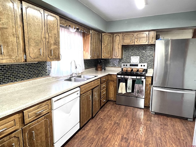 14702 Rd 14, Cahone, CO 81320 - kitchen featuring appliances with stainless steel finishes, a sink, dark wood-style floors, and decorative backsplash