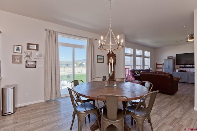 729 Spotted Pony Ct, Delta, CO 81416 - dining room featuring light wood-style flooring, a chandelier, plenty of natural light, and baseboards