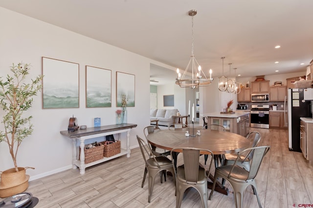 729 Spotted Pony Ct, Delta, CO 81416 - dining area featuring a chandelier, light wood-style flooring, recessed lighting, and baseboards
