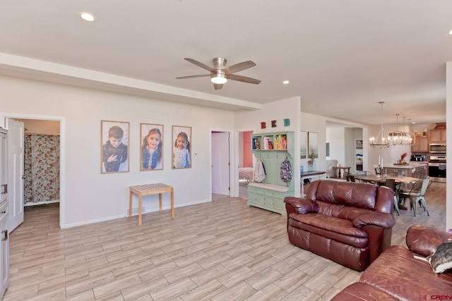 729 Spotted Pony Ct, Delta, CO 81416 - living room featuring a ceiling fan, a chandelier, baseboards, light wood-style flooring, and recessed lighting