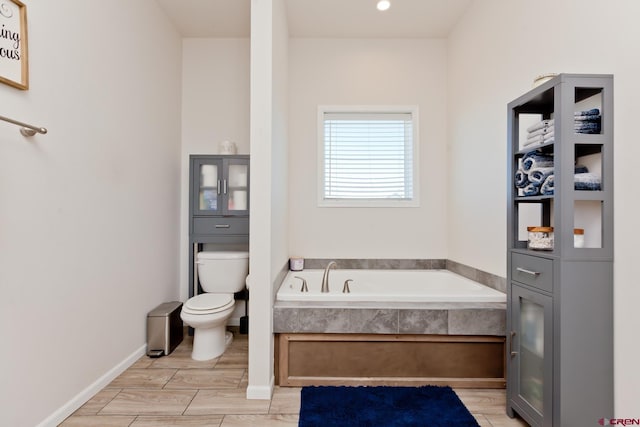 729 Spotted Pony Ct, Delta, CO 81416 - bathroom featuring a bath, toilet, and wood finished floors