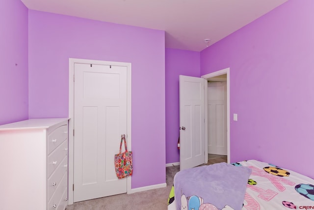 729 Spotted Pony Ct, Delta, CO 81416 - bedroom with light carpet and baseboards