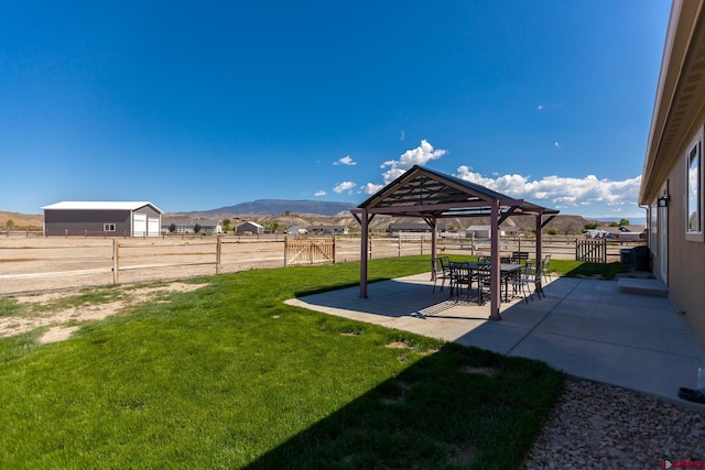 729 Spotted Pony Ct, Delta, CO 81416 - view of yard featuring a gazebo, a mountain view, and a patio