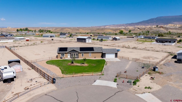 729 Spotted Pony Ct, Delta, CO 81416 - aerial view of property and surrounding area with a mountain backdrop
