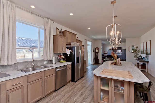 729 Spotted Pony Ct, Delta, CO 81416 - kitchen with appliances with stainless steel finishes, a sink, plenty of natural light, a chandelier, and recessed lighting