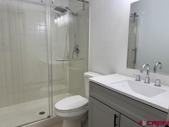 2149 Hartord Way Unit A, Montrose, CO 81401 - bathroom with a stall shower, toilet, and vanity