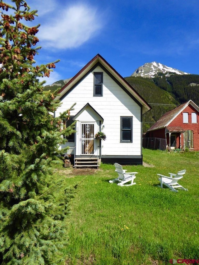 1572 Greene St, Silverton, CO 81433 - back of house featuring a mountain view and a lawn