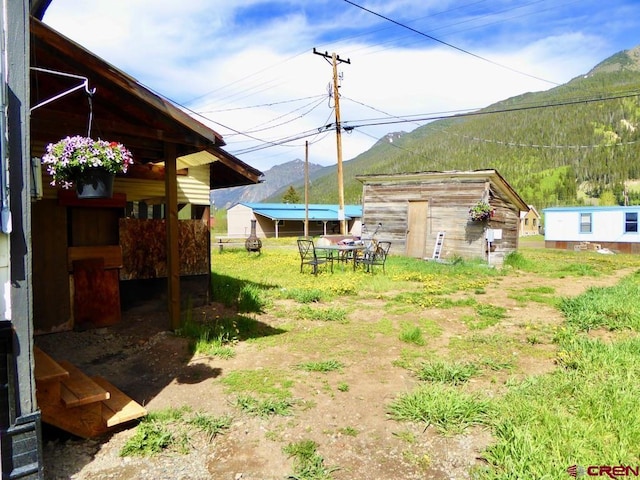 1572 Greene St, Silverton, CO 81433 - view of yard featuring a mountain view and an outdoor structure