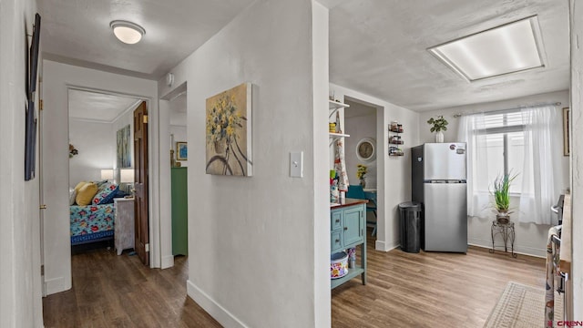 355 NW 5th St, Cedaredge, CO 81413 - kitchen featuring freestanding refrigerator, blue cabinetry, wood finished floors, baseboards, and butcher block countertops