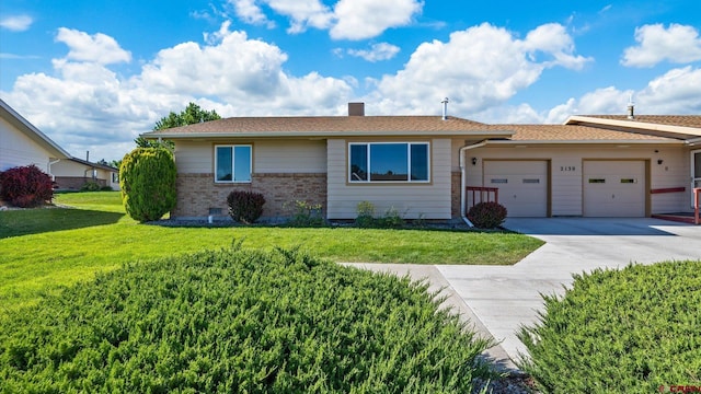 2130 Hartford Way Unit C, Montrose, CO 81401 - single story home featuring a garage, driveway, a front lawn, and a chimney