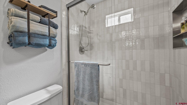 2130 Hartford Way Unit C, Montrose, CO 81401 - bathroom featuring a shower stall and a textured wall