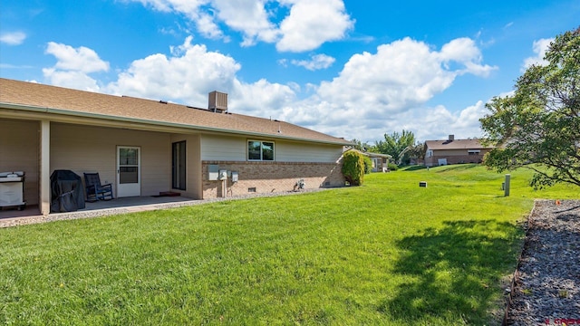 2130 Hartford Way Unit C, Montrose, CO 81401 - view of grassy yard featuring a patio area