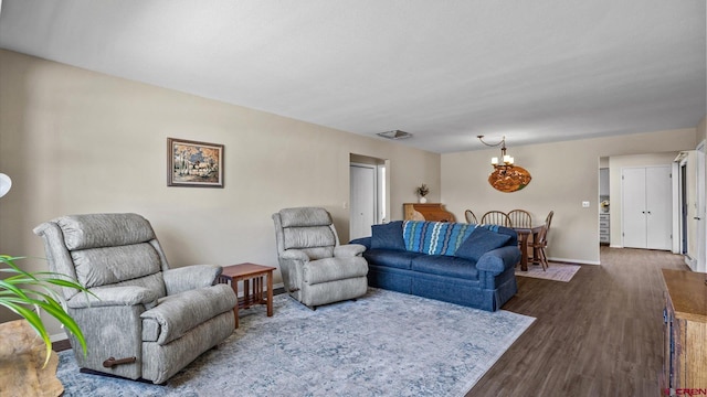 2130 Hartford Way Unit C, Montrose, CO 81401 - living room with a chandelier and dark wood-type flooring