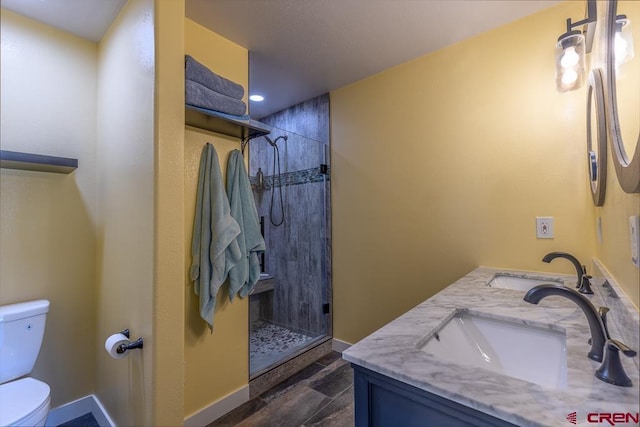 345 Meadows Cir, Bayfield, CO 81122 - full bathroom with tiled shower, double vanity, and wood finished floors