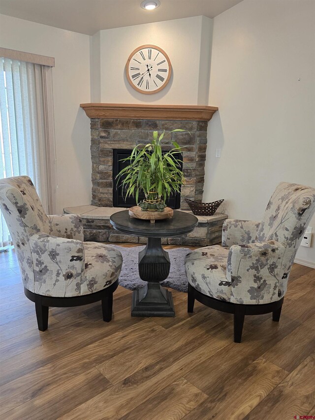 1285 Peppertree Dr, Montrose, CO 81401 - sitting room with wood finished floors and a fireplace