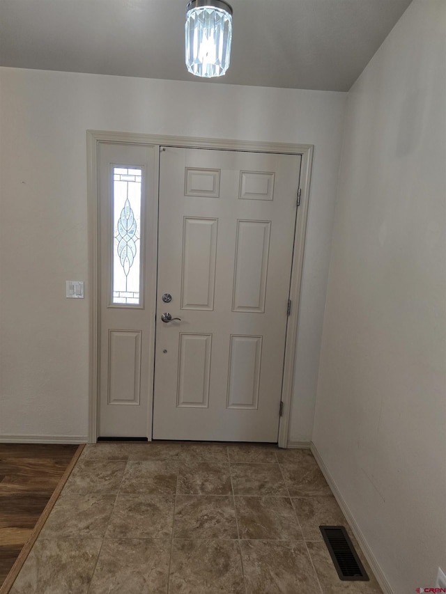 1285 Peppertree Dr, Montrose, CO 81401 - foyer featuring a chandelier and baseboards