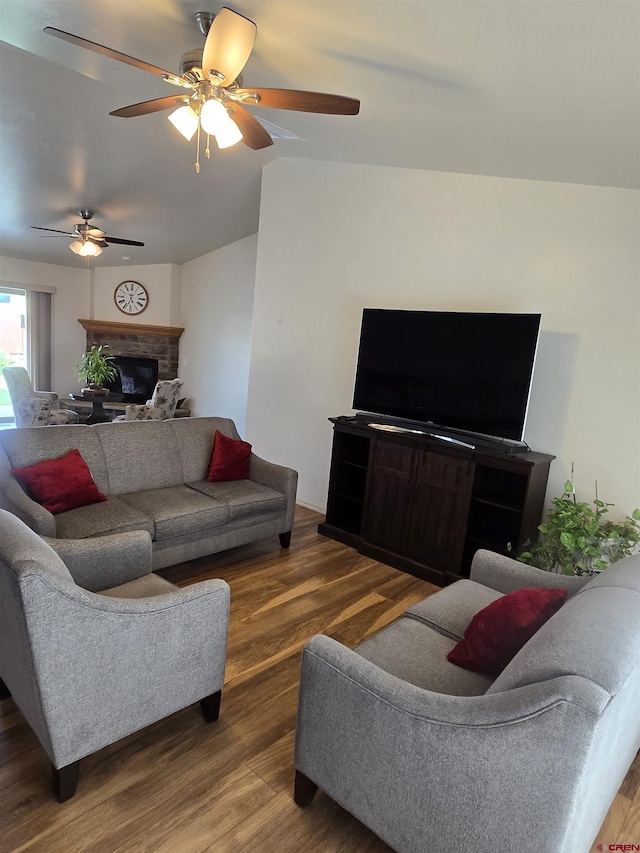 1285 Peppertree Dr, Montrose, CO 81401 - living area with wood finished floors, ceiling fan, and a fireplace