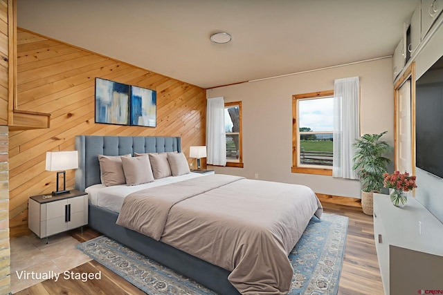 6038 Townsend Rd, Delta, CO 81416 - bedroom featuring wooden walls and wood finished floors