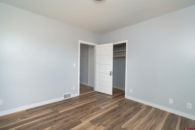 6038 Townsend Rd, Delta, CO 81416 - unfurnished bedroom featuring wood finished floors and a closet