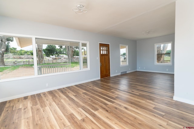 6038 Townsend Rd, Delta, CO 81416 - unfurnished living room featuring baseboards and wood finished floors