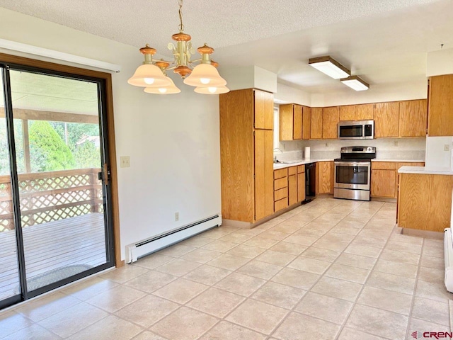 2343 Oldham Way, Montrose, CO 81401 - kitchen with appliances with stainless steel finishes, a baseboard heating unit, light countertops, brown cabinets, and a textured ceiling