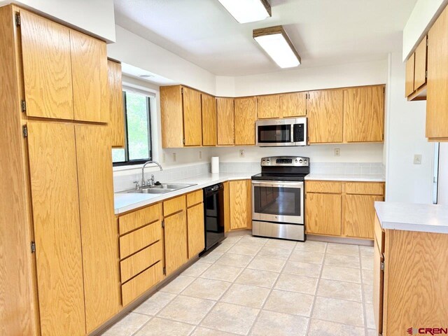 2343 Oldham Way, Montrose, CO 81401 - kitchen with appliances with stainless steel finishes and light countertops