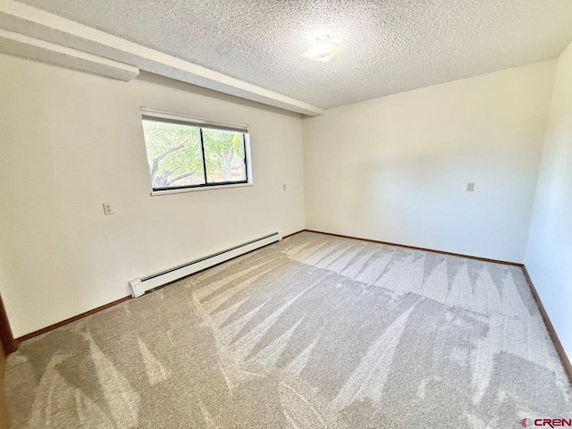 2343 Oldham Way, Montrose, CO 81401 - spare room with a baseboard radiator, a textured ceiling, and carpet flooring