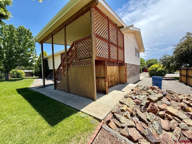 2343 Oldham Way, Montrose, CO 81401 - view of home's exterior with a lawn
