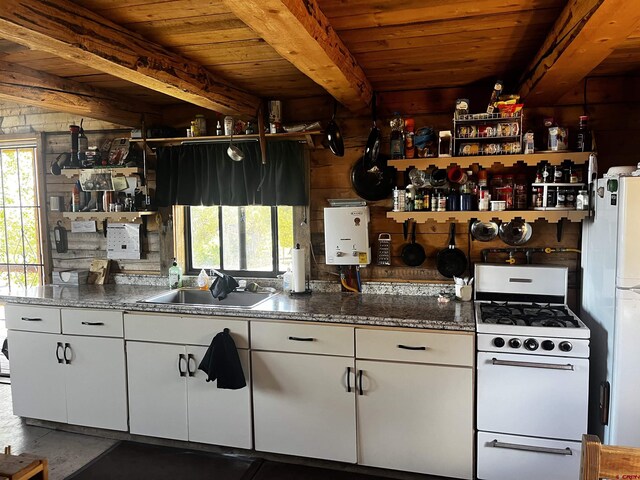 1165 Timber Ridge Rd, Montrose, CO 81401 - kitchen with white gas range oven, open shelves, white cabinetry, and a wooden ceiling with exposed beams