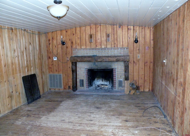 27793 Bb Rd, Nucla, CO 81424 - unfurnished living room with wooden walls, wood finished floors, and a fireplace