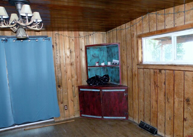 27793 Bb Rd, Nucla, CO 81424 - misc room with a chandelier, wood walls, hardwood / wood-style flooring, and wood ceiling
