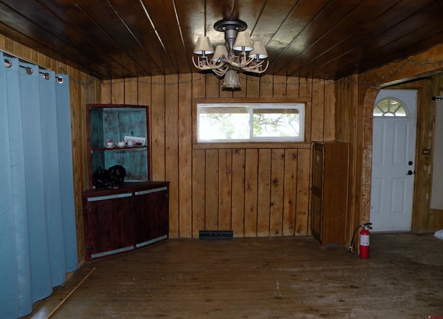 27793 Bb Rd, Nucla, CO 81424 - unfurnished dining area with wooden ceiling, wood-type flooring, a chandelier, and wood walls