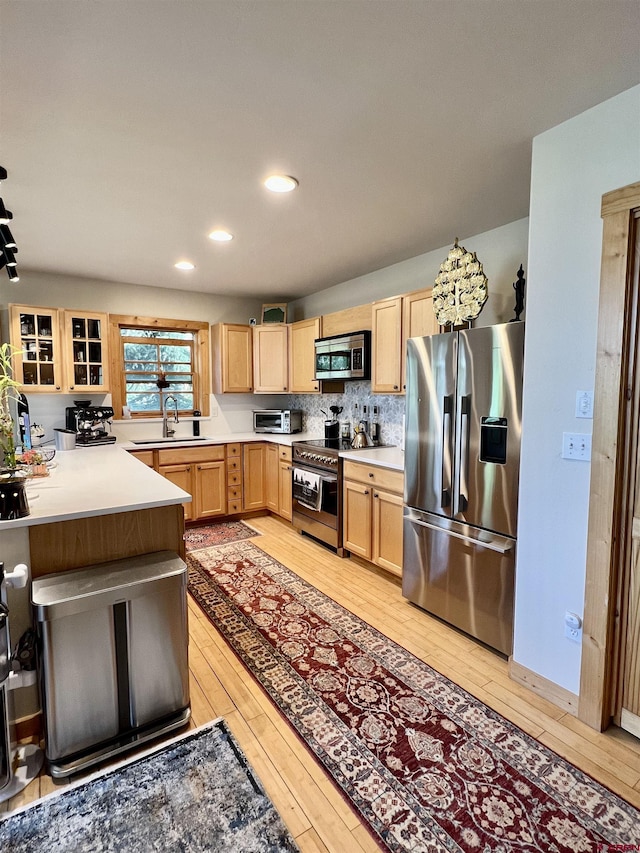 607 Second St Unit B, Crested Butte, CO 81224 - kitchen with stainless steel appliances, light brown cabinets, light wood-style floors, light countertops, and recessed lighting