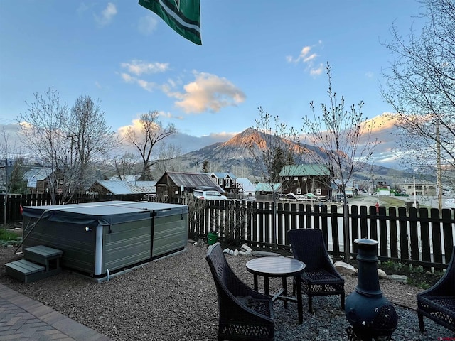607 Second St Unit B, Crested Butte, CO 81224 - fenced backyard with a mountain view and a hot tub