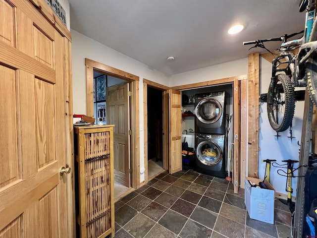 607 Second St Unit B, Crested Butte, CO 81224 - washroom featuring stacked washer and clothes dryer and dark stone finish flooring