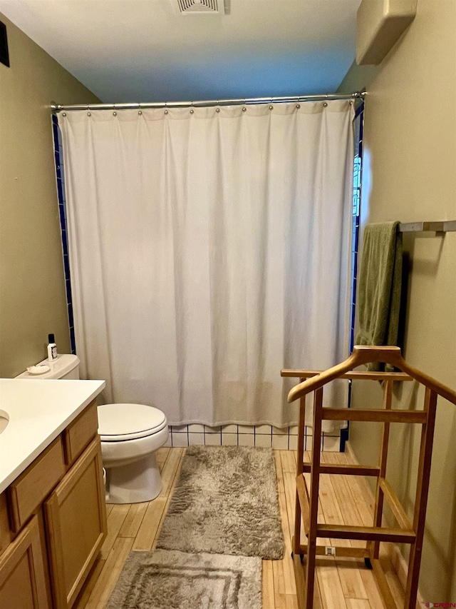607 Second St Unit B, Crested Butte, CO 81224 - bathroom featuring wood finished floors, vanity, and a shower with shower curtain