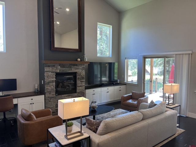 43 Big Bend Loop, Durango, CO 81301 - living area with high vaulted ceiling, dark wood-style flooring, ceiling fan, an office area, and a stone fireplace