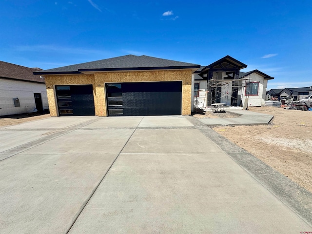 1508 Criterion St, Delta, CO 81416 - view of front of property with driveway, a garage, and a shingled roof