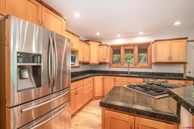 95 Ute Pass W, Durango, CO 81301 - kitchen with stainless steel appliances, light wood-style flooring, light brown cabinets, and recessed lighting