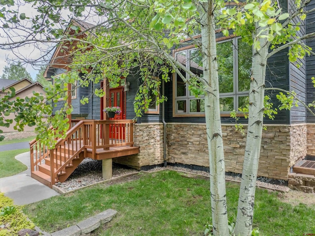 95 Ute Pass W, Durango, CO 81301 - view of side of home featuring stone siding and a yard