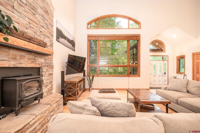 95 Ute Pass W, Durango, CO 81301 - living room with wood finished floors, high vaulted ceiling, and a wood stove